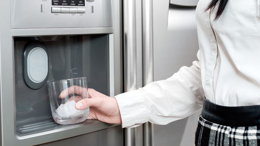 Woman Getting Ice from Ice Machine